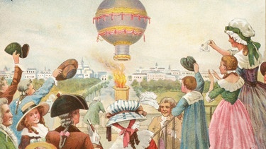 Historisches Sammelbild: Zuschauer jubeln dem ersten Aufstieg eines Heißluftballons zu. Erfunden wurde er von den Brüdern Montgolfier. | Bild: picture alliance / akg-images | akg-images