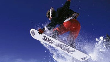 Snowboarder beim Sprung in der Luft | Bild: Photosphere