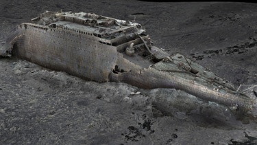 So sieht das Wrack der Titanic aus. Um das Schiff ganz zu sehen, mussten 700.000 Aufnahmen gemacht und zu einem Scan zusammengesetzt werden. Das Wrack der Titanic wurde im "größten Unterwasser-Scan-Projekt der Geschichte" kartiert und 3-D-Scans erstellt. Am 17. Mai 2023 veröffentlichte die BBC zusammengesetzte 3-D-Bilder. Nun wollen Wissenschaftlern herausfinden, was beim Unglück genau passiert ist. | Bild: picture alliance / ZUMAPRESS.com | Atlantic Productions/Magellan