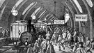 Fahrgäste in einer Station der 1863 eröffneten Londoner U-Bahn (Darstellung aus: Gustave Dore - "A Pilgrimage"  aus dem Jahr 1872). | Bild: picture-alliance/dpa