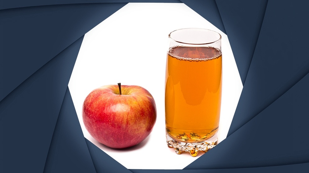 Symbolbild: Blick durch eine Kameralinse auf einen Apfel und ein Glas Apfelsaft | Bild: colourbox.com; Montage: BR