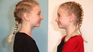 Zwei Mädchen, eineiige Zwillinge, blicken sich an.  | Bild: picture-alliance/dpa