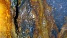 Dank Vulkanismus: Goldadern im Gestein einer Goldmine | Bild: picture-alliance/dpa