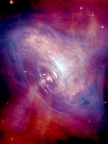 Der Pulsar im Inneren des Krebsnebels - Komposit aus einer optischen Aufnahme von Hubble mit einer Röntgenaufnahme von Chandra. | Bild: NASA/CXC/ASU/J. Hester et al.