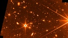 Dieses Testbild des James Webb-Weltraumteleskops ist noch nicht in Farbe, zeigt aber bereits Sterne und prächtige Galaxien.  | Bild: NASA, CSA, and FGS team