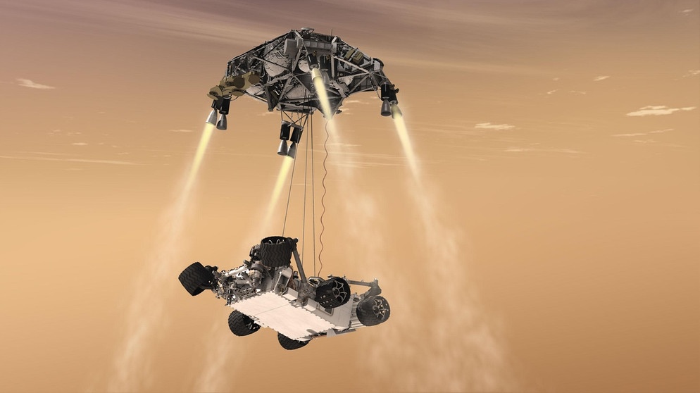 Illustration: Curiosity, der Mars-Rover der NASA, wird auf den Boden abgeseilt. | Bild: NASA